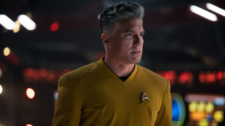 Christopher Pike (Anson Mount) stands gazing ahead sternly in Star Trek: Strange New Worlds
