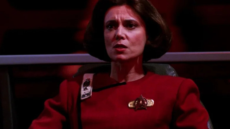 Rachel Garrett (Tricia O'Neil) sits in a darkened bridge in Star Trek: The Next Generation