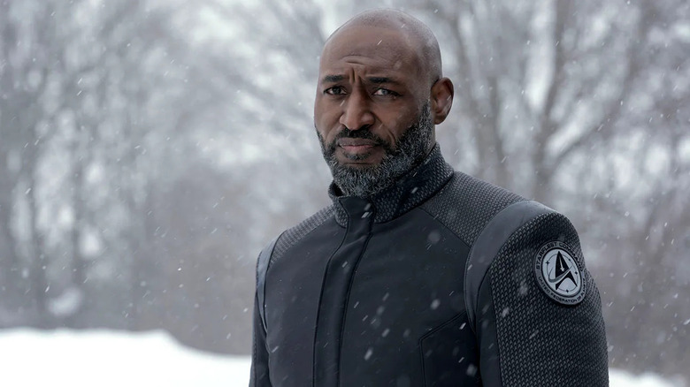 Robert April (Adrian Holmes) stands stoically in the snow in Star Trek: Strange New Worlds
