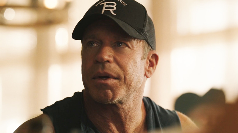 Taylor Sheridan's Travis Wheatley looks up as he sits at a poker game in Yellowstone