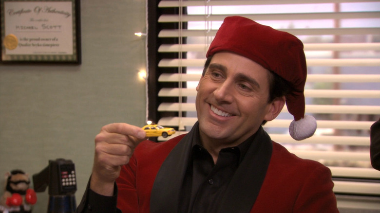 Michael (Steve Carell) holding up a toy car on The Office