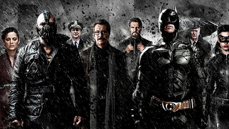 The Dark Knight Rises cast in the rain