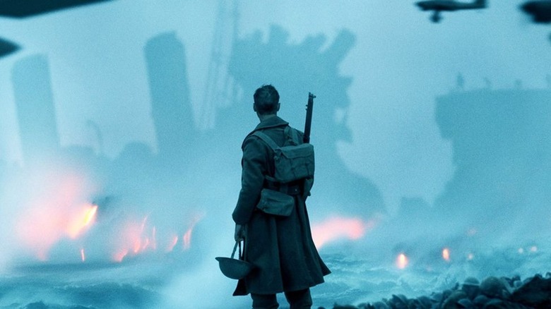 Soldier stares at a wrecked battleship