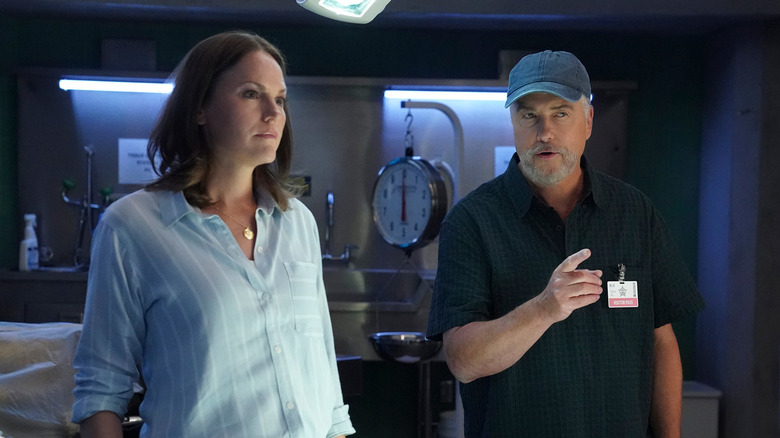 Sara and Grissom standing next to each other on 