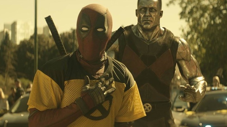 Deadpool in trainee X-Men vest stood next to Colossus in Deadpool 2