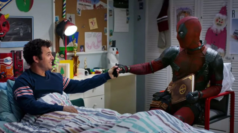 Fred Savage in bed with Deadpool sat next to him in Once Upon a Deadpool