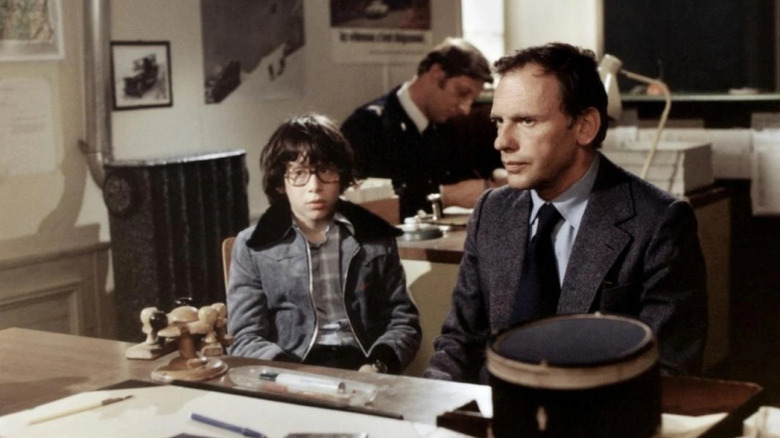 Richard Constantini as Marc and Jean-Louis Trintignant as Alex, reporting to the police in The Intruder