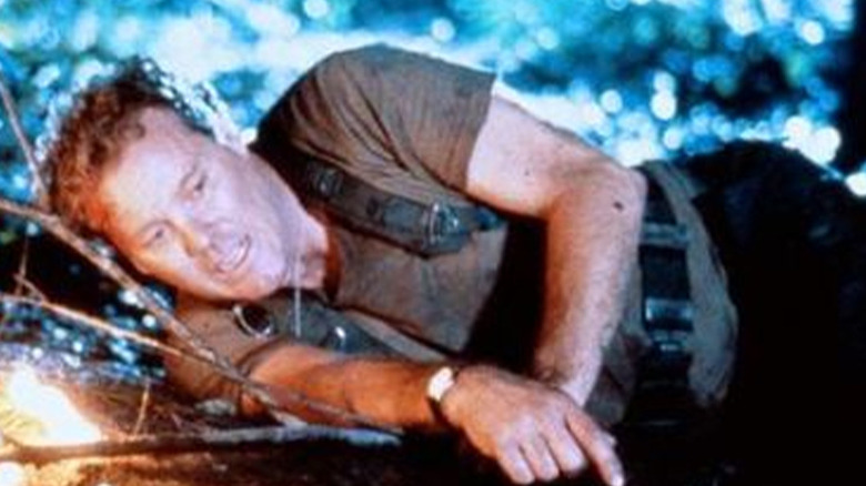 Wings Hauser as Paul, taking a break from fighting a monster in Watchers 3