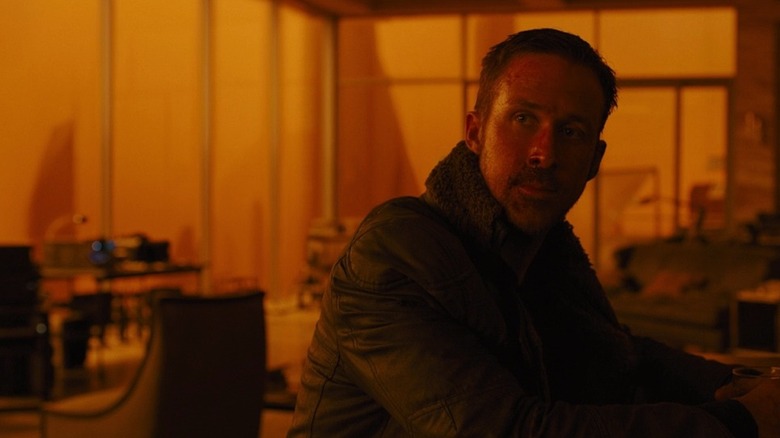 Ryan Gosling looks into distance as K in Blade Runner 2049