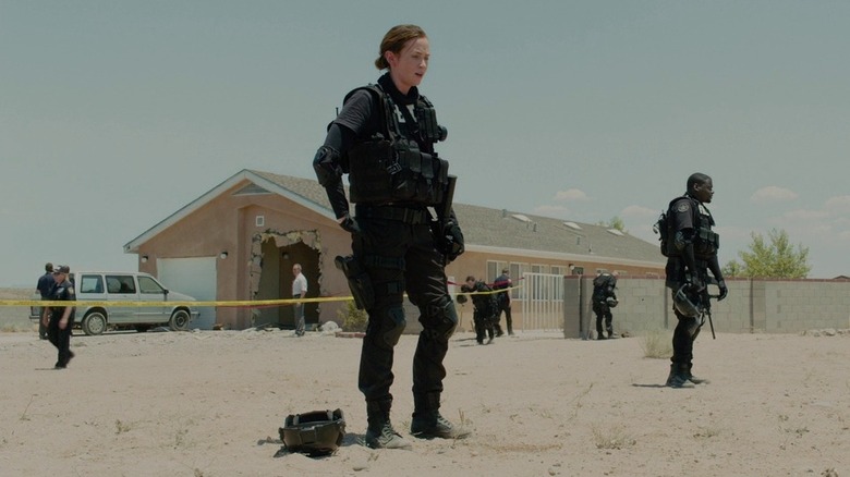 Emily Blunt's Kate Macer outside a crime scene in Sicario