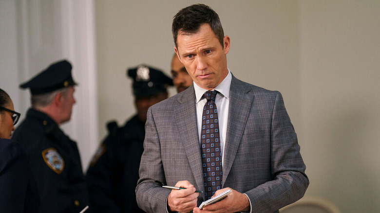 Law & Order Frank Cosgrove takes notes