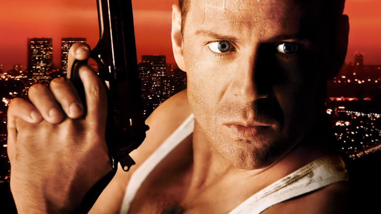 John McClane holds a gun