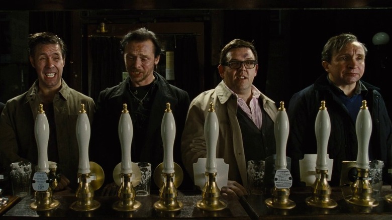 Group of friends with pints at bar in The World's End