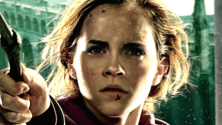 Emma Watson as Hermione Granger wielding wand
