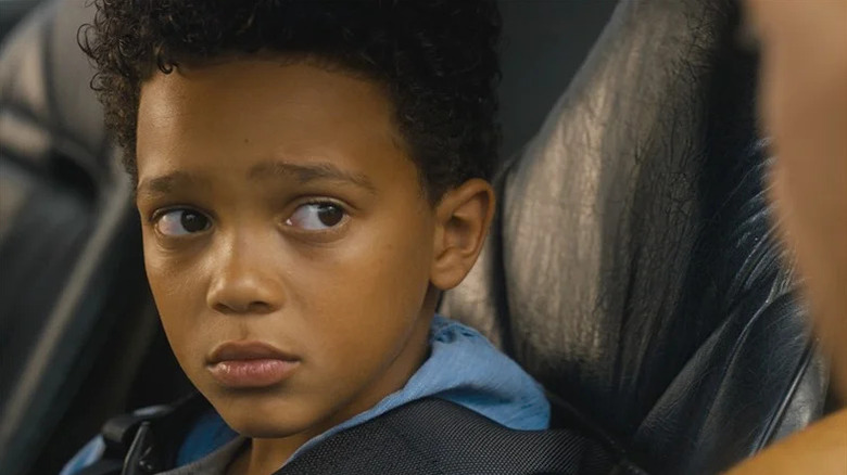 Little Brian sitting in car