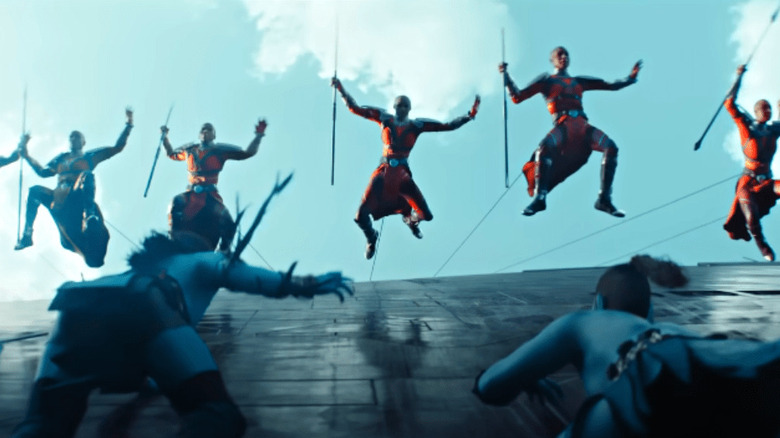 Dora Milaje jumping climbing ship Black Panther: Wakanda Forever