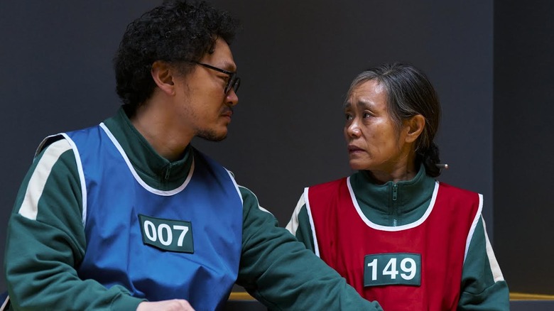 Young Dong-John Young Sick and Kang I Shim Jum, wearing colored jackets on the squid game