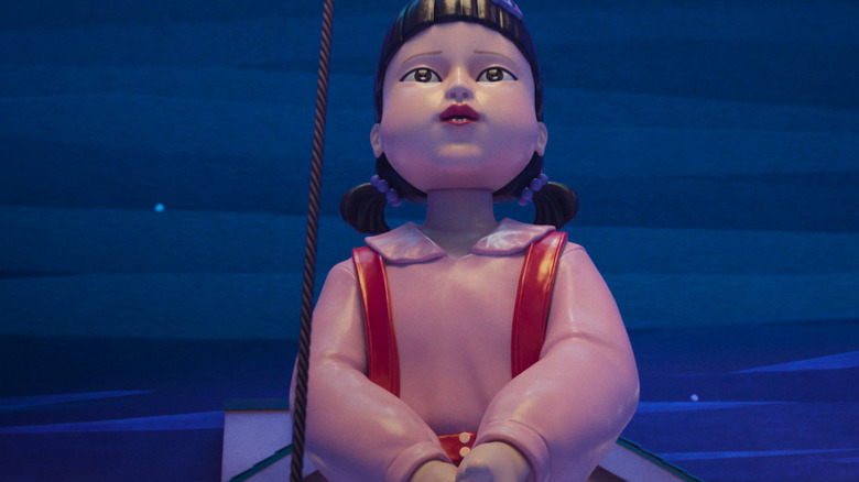 A creeping doll with a jump rope on the squid game