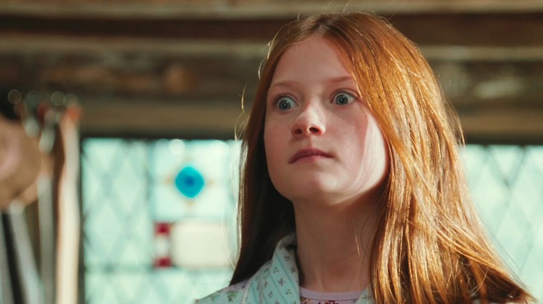 Bonnie Wright's Ginny Weasley looks shocked to see Harry (offscreen) in Harry Potter and the Chamber of Secrets