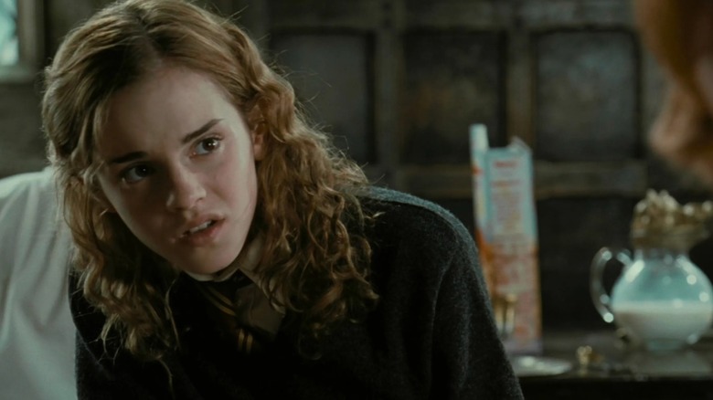 Emma Watson's Hermione Granger looks at someone off screen in Harry Potter and the Goblet of Fire