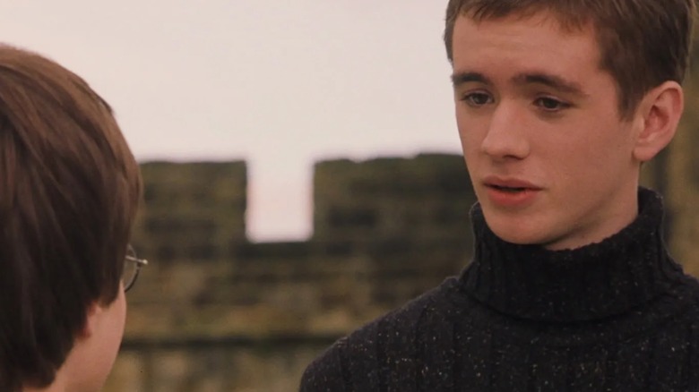 Daniel Radcliffe's Harry Potter listens to Sean Biggerstaff's Oliver Wood speak in Harry Potter and the Sorcerer's Stone