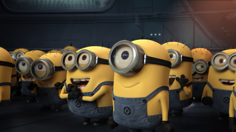 Minions listening intently to Gru