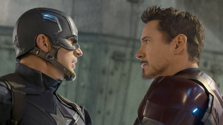 Captain America and Tony Stark star intensely at each other in Captain America: Civil War