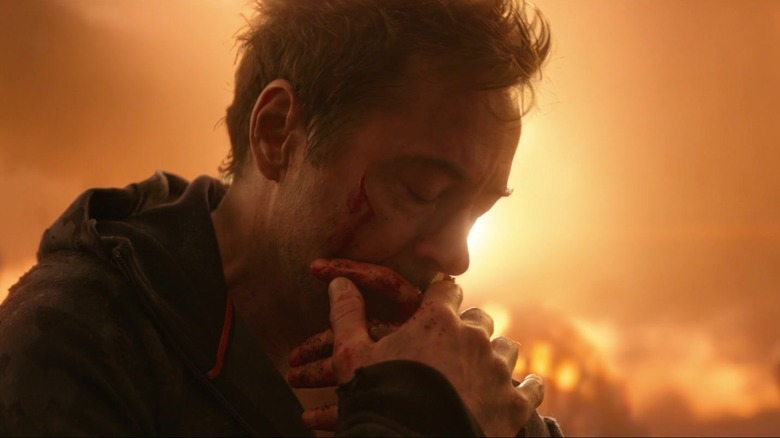 Tony Stark grieving and holding Peter's glove in his hands in Avengers: Infinity War