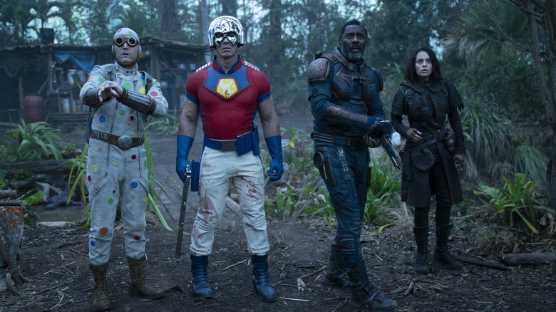 Polka Dot Man (David Dastmalchian), Peacemaker (John Cena), Bloodsport (Idris Elba), and Ratcatcher 2 (Daniela Melchior) look ahead of them in The Suicide Squad