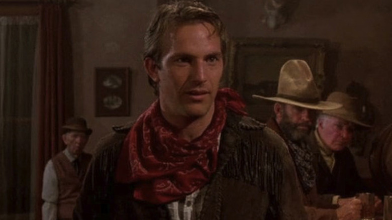 Jake (Kevin Costner) standing in a saloon in "Silverado."