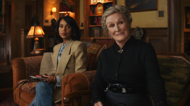 Vera and Martha sitting on the couch looking skeptical in Wake Up Dead Man
