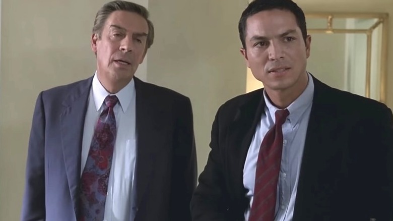 Briscoe and Curtis in a hotel room