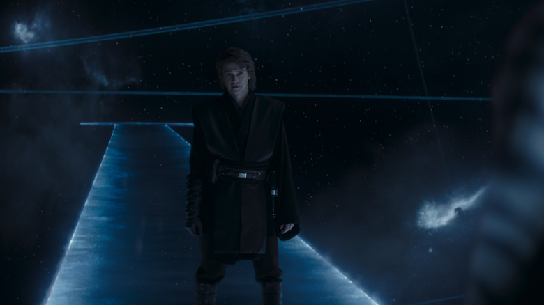 Anakin stands on a dark platform