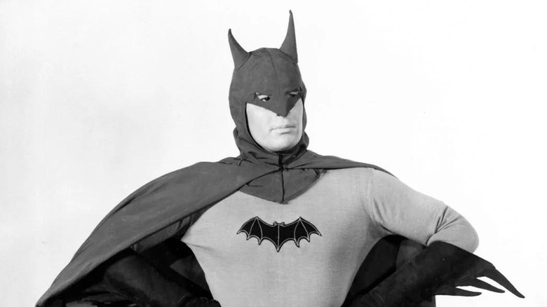 Lewis Wilson as Batman, standing with his hands on his hips, in the 1943 Batman serial