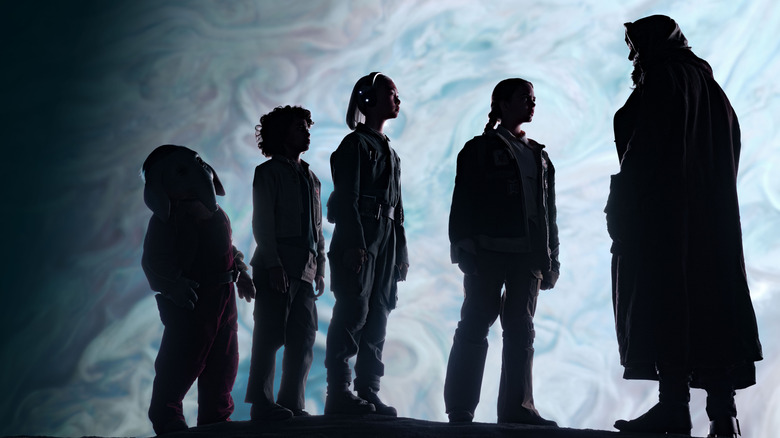 The Skeleton Crew gang being led at night by Jod Na Nawood in Star Wars: Skeleton Crew