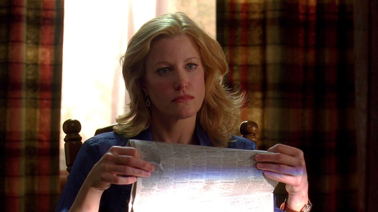 Anna Gunn's Skyler White reading the newspaper in Breaking Bad