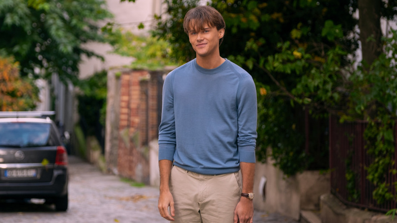 Conrad smiling on Belly's street in Paris on The Summer I Turned Pretty