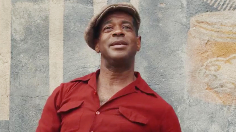 Alex Désert smiling as Edgar in A League of their Own