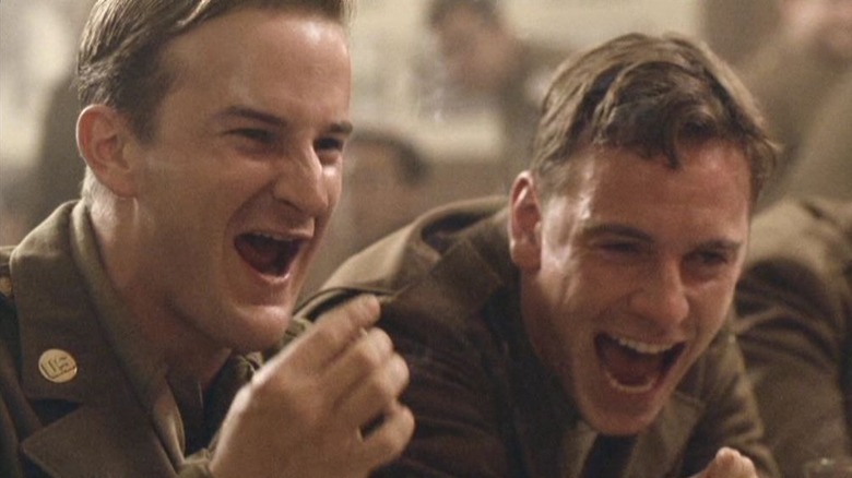 Muck laughing with a friend