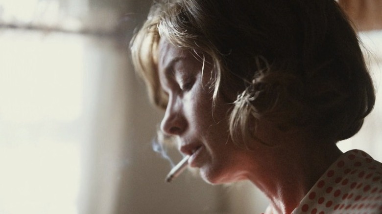 Gladys smoking a cigarette