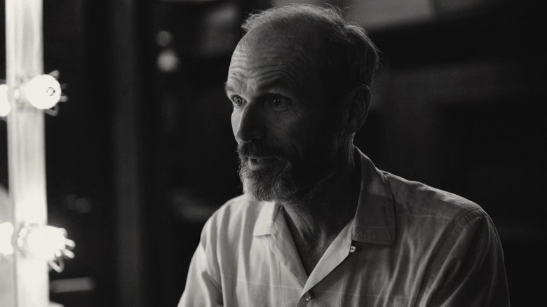 Whitey talking with his eyebrows raised