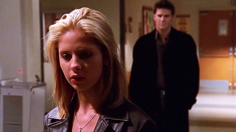 Buffy the Vampire Slayer's Sarah Michelle Gellar turning away from David Boreanaz