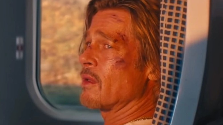 Brad Pitt sitting on train