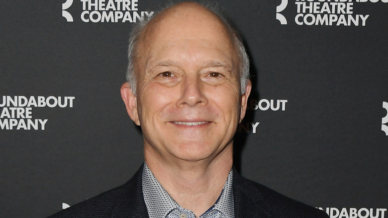Dan Butler smiling on red carpet