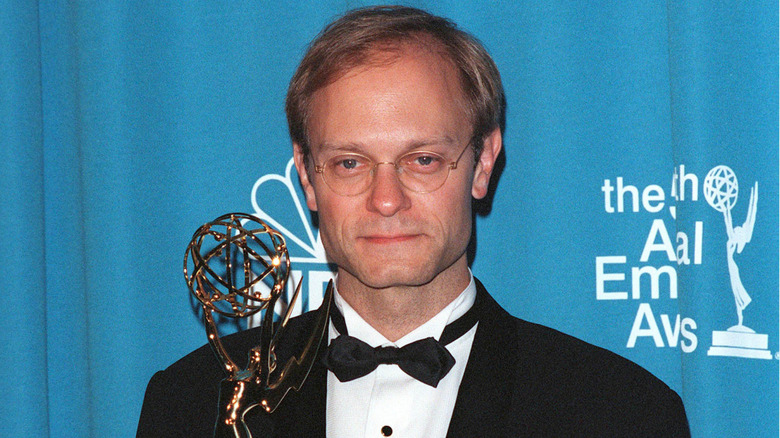 David Hyde Pierce smiing with Emmy in 1998