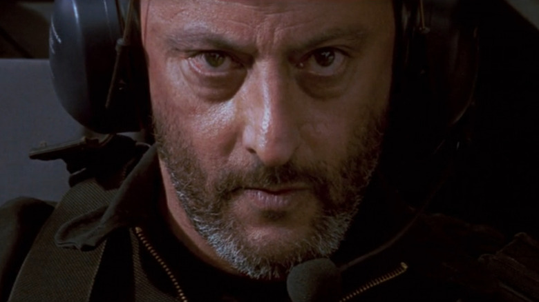 Jean Reno as Krieger flying a helicopter in Mission: Impossible
