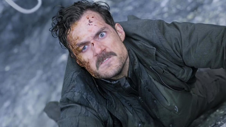 Henry Cavill as John Lark in Mission: Impossible - Fallout on the side of a mountain