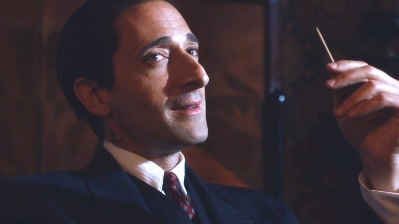 Adrien Brody's Luca Changretta holding a toothpick on Peaky Blinders