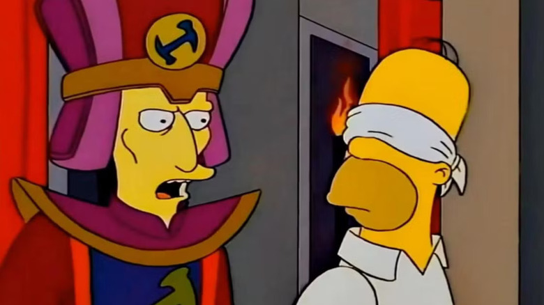 The head of the Stonecutters talking to a blindfolded Homer on The Simpsons.