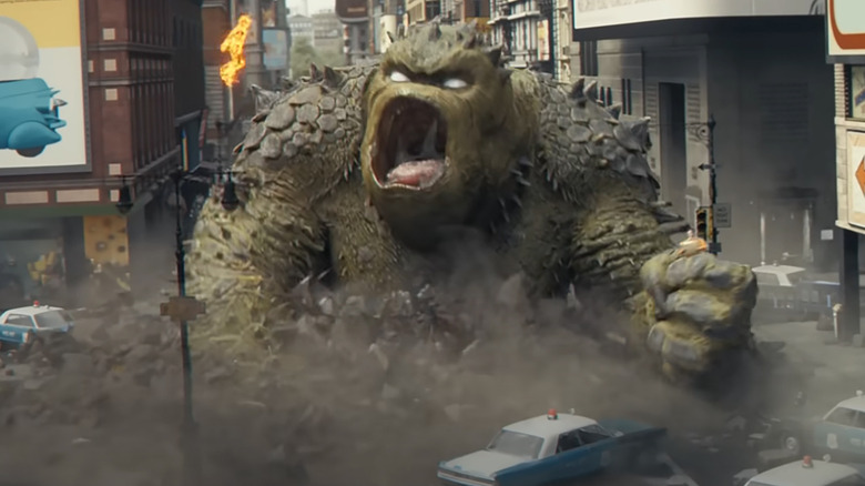 The Human Torch hovering above Giganto in Fantastic Four: First Steps